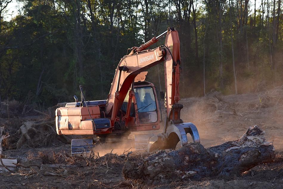 excavator at a construction site in the forest
