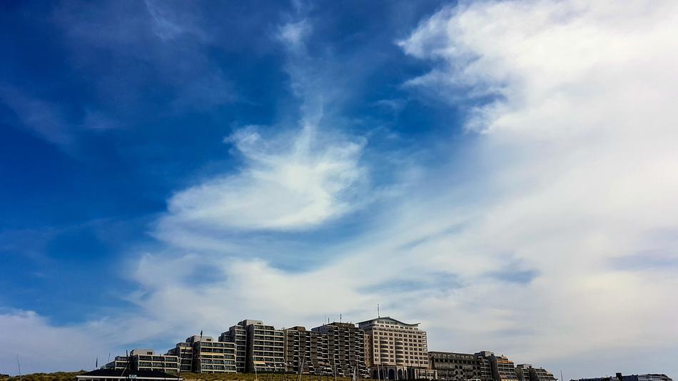 hotel complex under the sky with white clouds