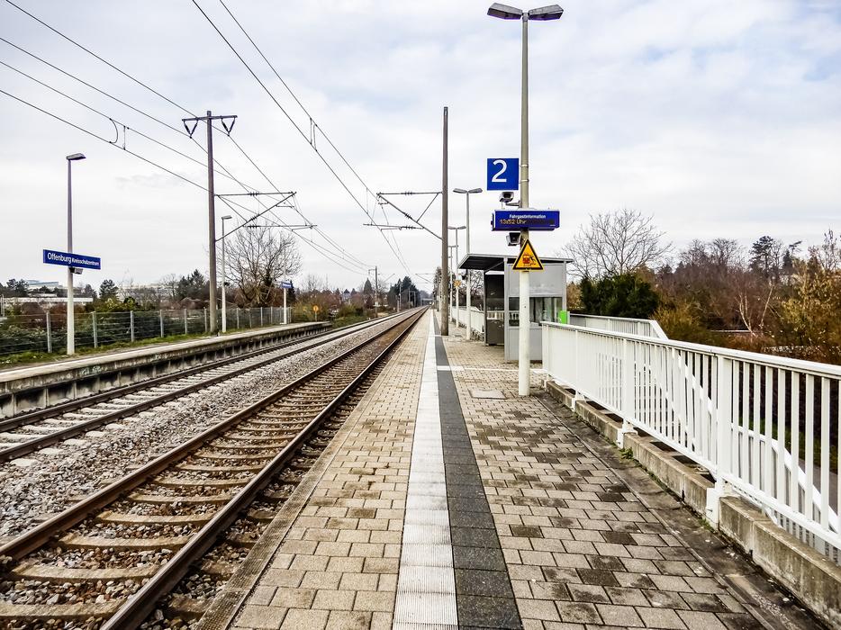 Railway line for trains, on the bridge, among the colorful trees