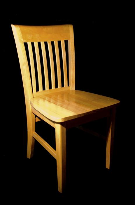 wooden chair in the dark