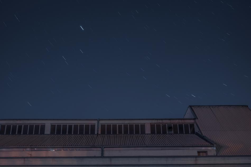 Roof, of the industrial warehouse, under the beautiful night sky with the stars