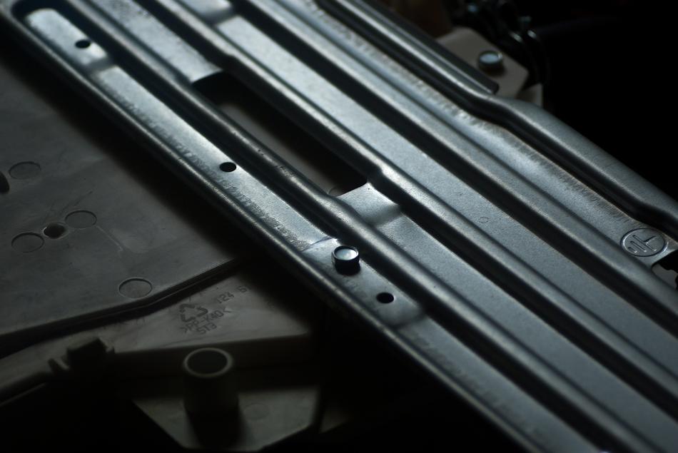 Black, alloy plate of the wash machine in light
