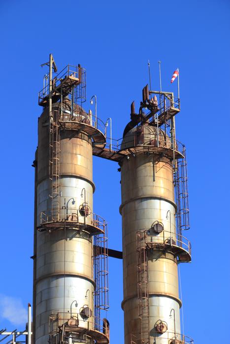 Industry equipment at blue sky with white clouds on background in Spain