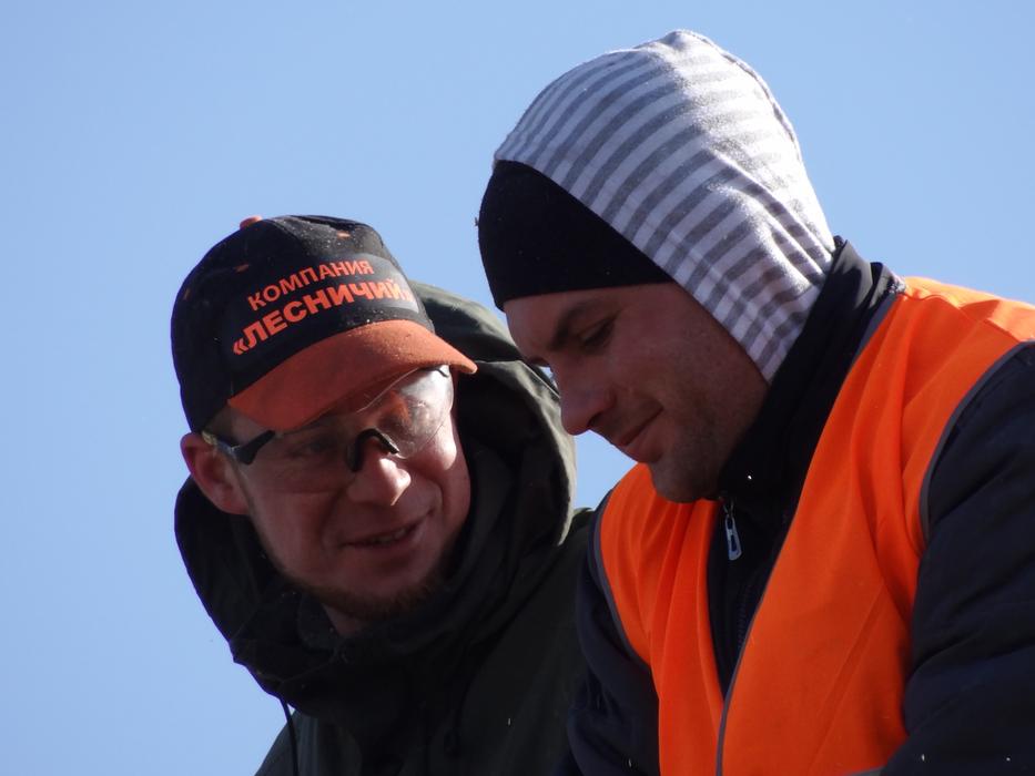 Portrait of the forest workers, at blue sky on background