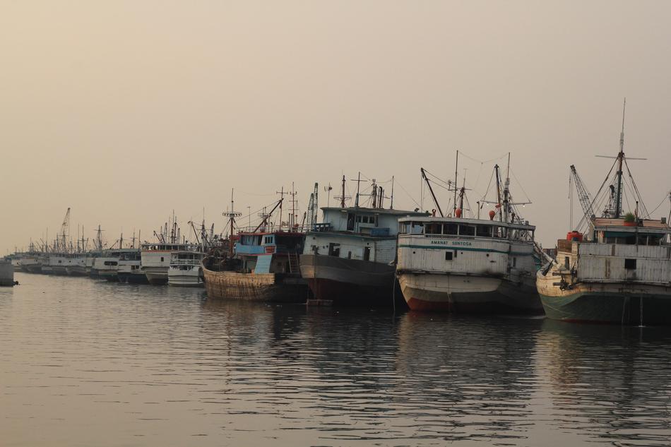 ships in the harbor at dusk