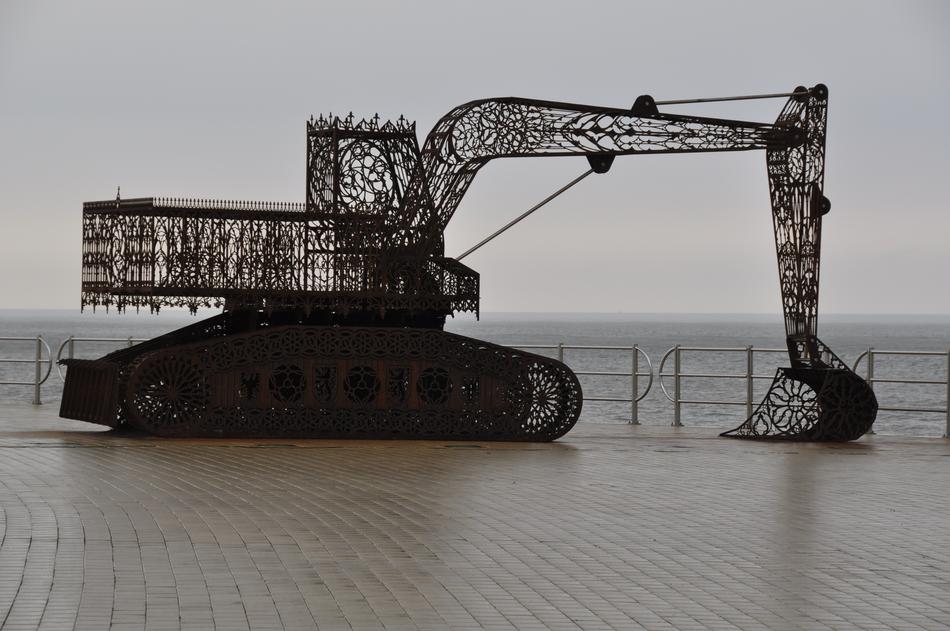 Sculpture of the excavator, on the shore of the sea in Middelkerke, Belgium