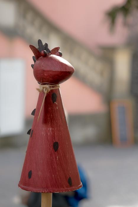 Close-up of the cute, red animal figure, at blurred background