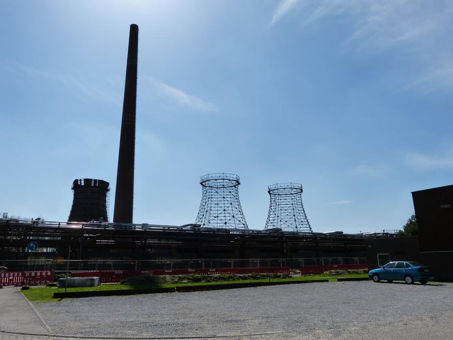 Landscape with the towers of Zollverein, at blue sky with white clouds, in sunlight
