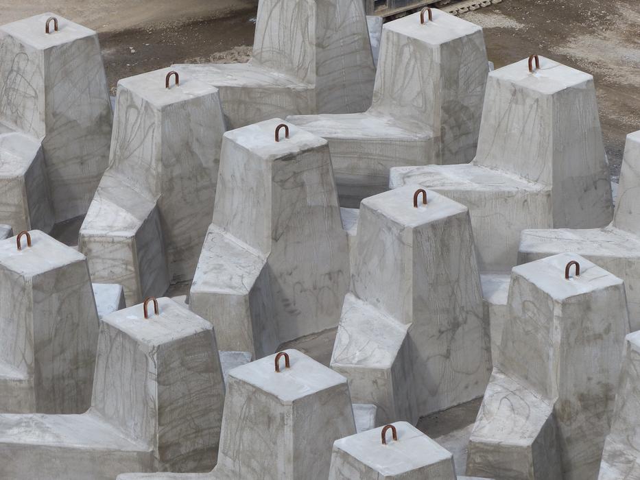 Grey concrete ballasts at the pier