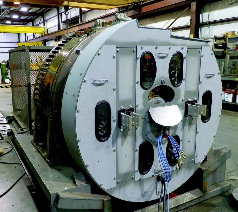 Close-up of the shiny railroad generator machine, on the test stand