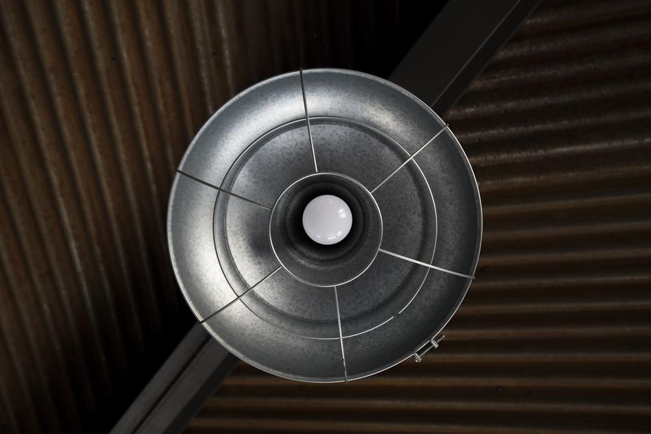 round metal chandelier on the ceiling