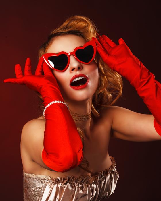 blonde in red gloves and sunglasses