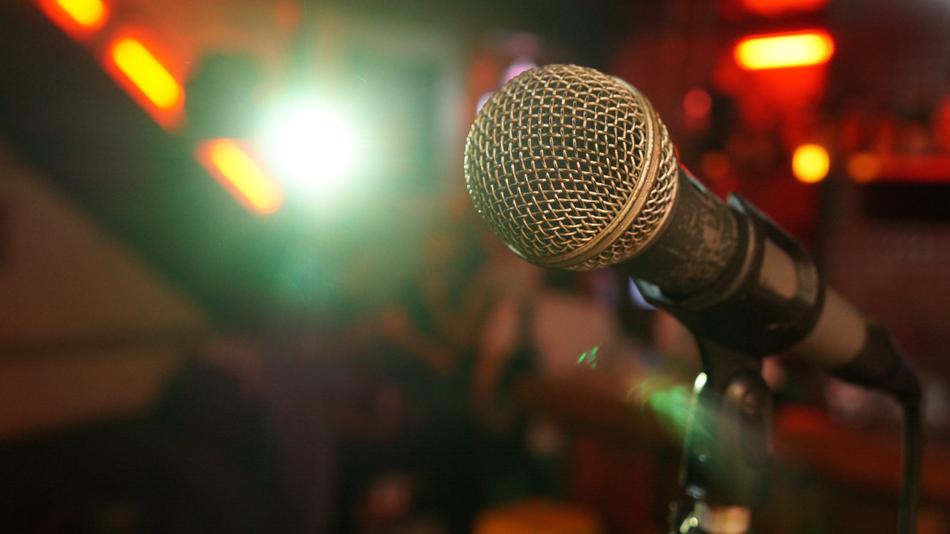 microphone on blurred background on stage