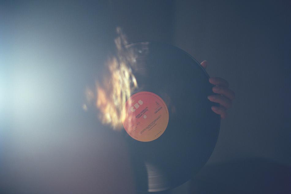 big vinyl record in hands in haze