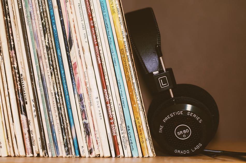 Headphones and vinyl records on shelf
