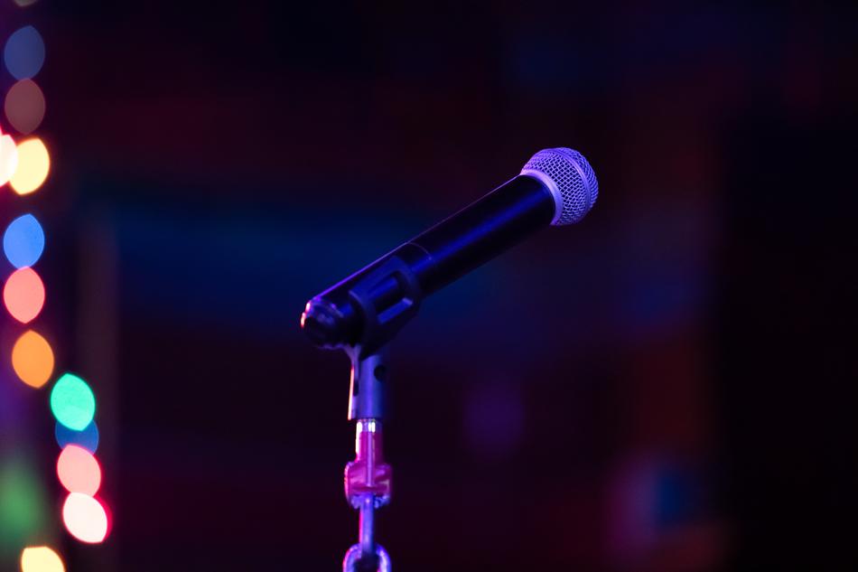 Microphone on blurred background with the lights