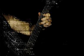 abstract image of the hand of a musician and guitar fretboard