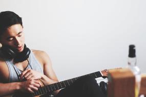 young man playing guitar