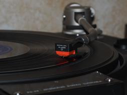 Close-up of the beautiful, shiny, black vinyl record on play