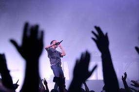 the hands of fans at the singer's concert