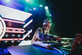 DJ at the music desk at a party