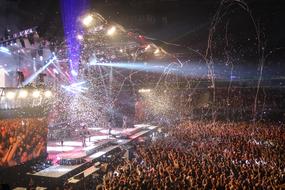 crowd of people at a concert by Paul Stanley