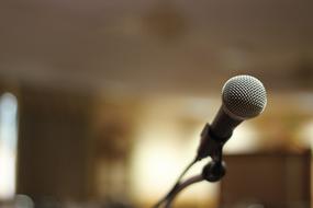 Close-up of the beautiful, gray and black microphone in light