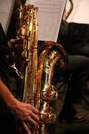 Saxophone in male hands