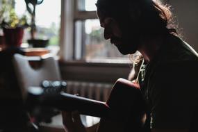 Man Playing on guitar