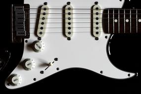 white Fender Guitar