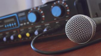 Close-Up of microphone at blurred Electronic equipment