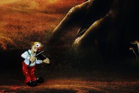 painted clown with a violin in the forest