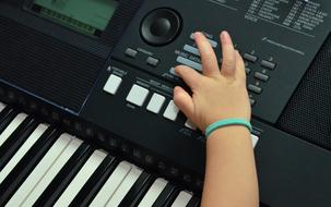 Keyboard Piano and child hand