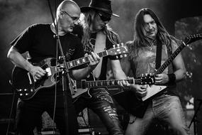 black and white photo of a swedish rock band on stage