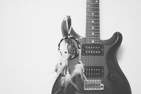 Black and white photo of the guitar with the decorations