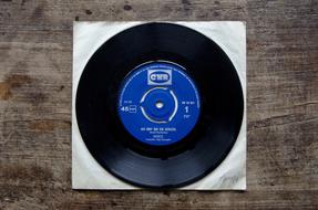 vintage vinyl Disc on wooden table