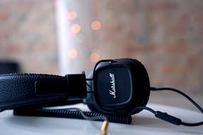 black Marshall headphone on table