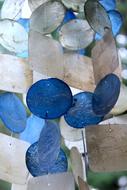 Beautiful, blue and white wind chime, hanging in summer