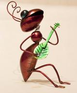 metal ant with green guitar