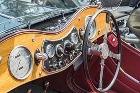 dashboard and steering wheel of a retro car, close-up