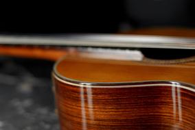 macro photo of a wooden case of a guitar