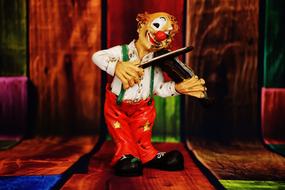 Clown plays violin, Funny Figurine