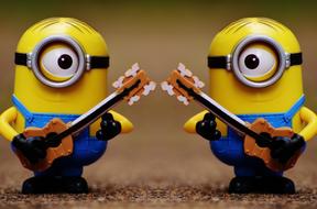 a pair of minions with guitars