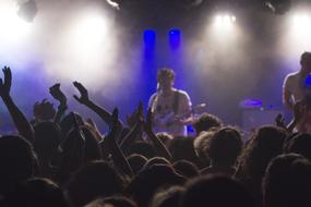 people at the concert in the spotlight
