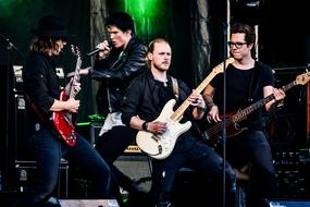 male rock music band on performance