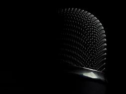 black microphone on the black background