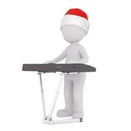 white man in a Christmas hat plays the electric piano