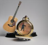 photo of guitar and pocket watch