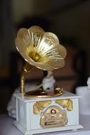 golden phonograph on blurred background