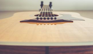 Macro photo of a lying guitar body